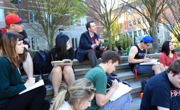 students and an instructor in class outside the library