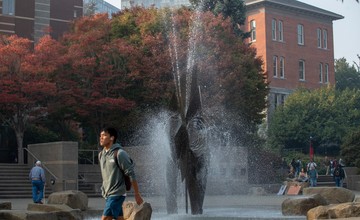 A fountain in the middle of a campus.