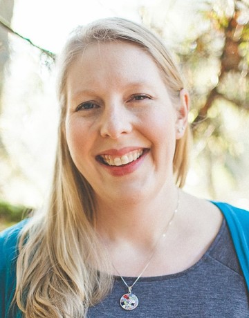 Amy Lonn O'Brien in front of foliage