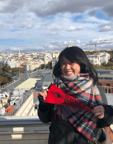 woman with SU flag