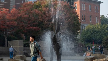 A fountain in the middle of a campus.