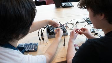 Students working with electrical equipment