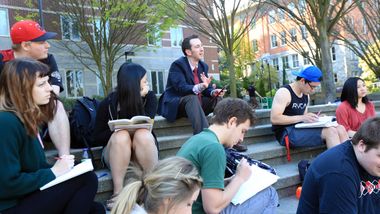 students and an instructor in class outside the library