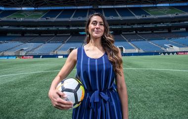 A sport MBA student holding a soccer ball