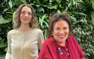 Yolanda and Jeanette's photo with greenery on the background