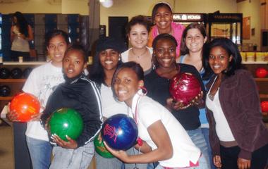 A group of students holding bowling balls