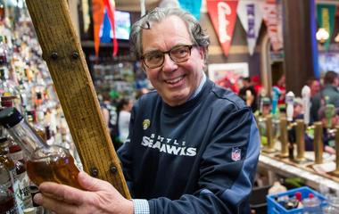Alumnus Mick McHugh behind the bar of FX McRory
