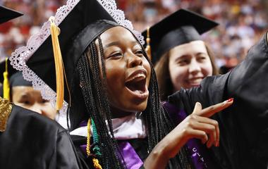 A graduate at undergrad commencement