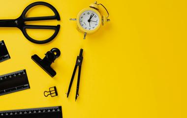 Stationery items on yellow background