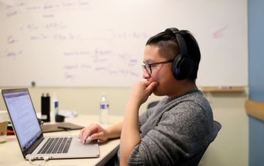 Graduate student Bowen Chen, from Shanghai China, studies in the library on campus for his finals in the Albers Master of Science in Finance (MSF) program