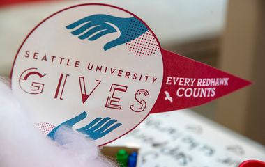 A promotional sticker for seattle university, with text 