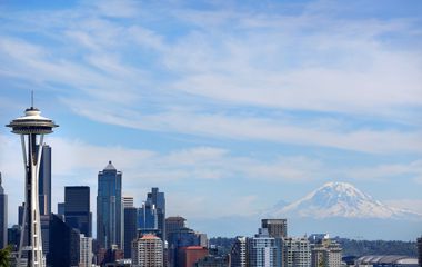 Seattle skyline with space needle and mount rainier in the background.