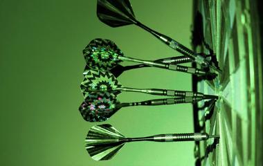 Photo of darts in a dartboard
