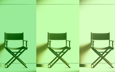 Image of three director's chairs in a row