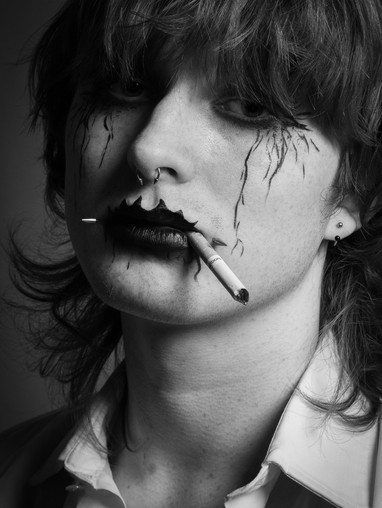 a man smoking a cigarette