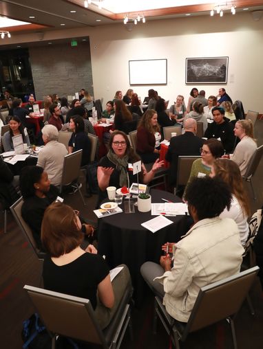 Students talking at tables in the third annual LinkUp networking event