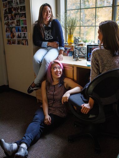 students talking in dorm room