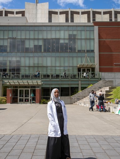 Graduate student Nazira Juneiyd, Doctorate of Nursing Practice, Class of 22, standing in front of the Lemieux Library