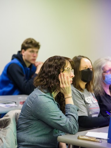 People in a classroom listening to a speaker