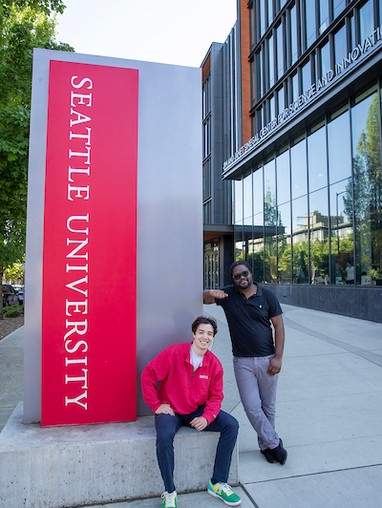Alumni on campus in front of the Sinegal Center
