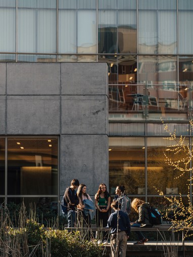 A group of people standing in front of a building.