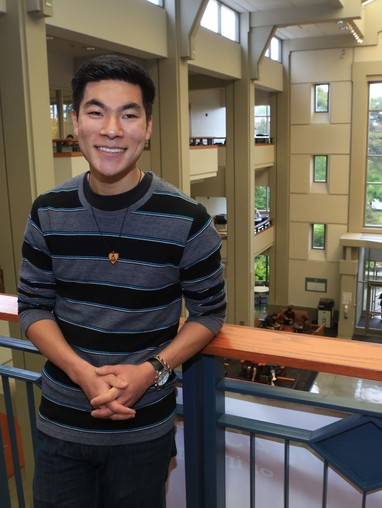 A man standing on a railing.