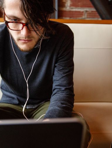 Student Working on a Laptop at a Table