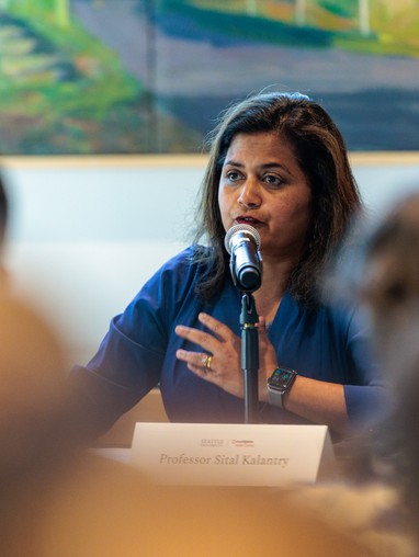 Director Sital Kalantry speaking at microphone