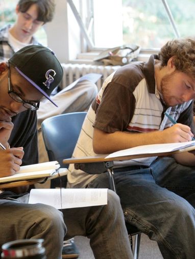 Photo of students writing in class