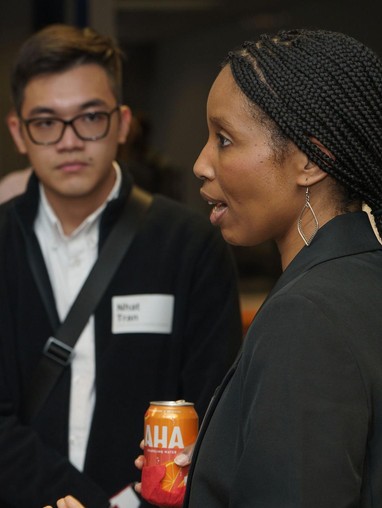 Students and mentors engaging in conversation at a networking event.