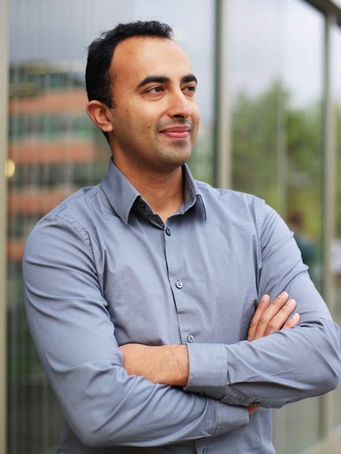 An EMBA student with his arms crossed