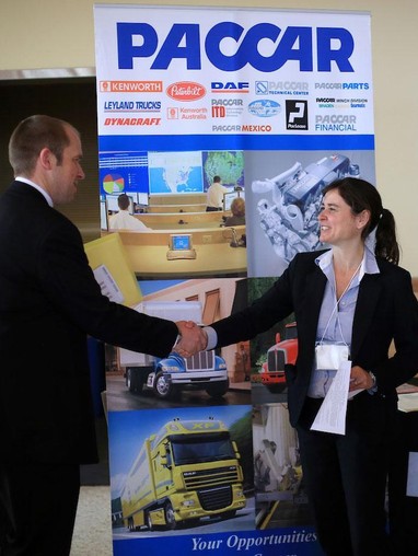 Student and recruiter shaking hands