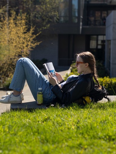 Student reading outside
