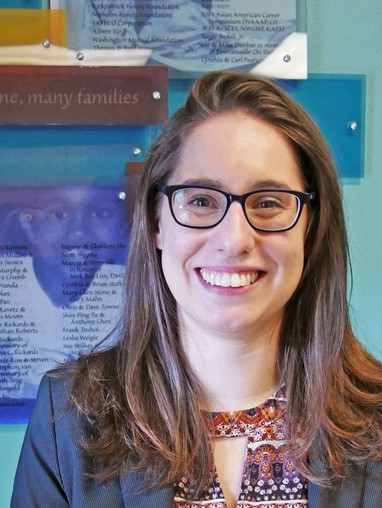 Student Smiling in Front of Presentation
