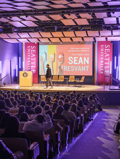 Sean Tresvant, CEO of Taco Bell, speaking in Pigott Auditorium as part of the Executive Speaker Series