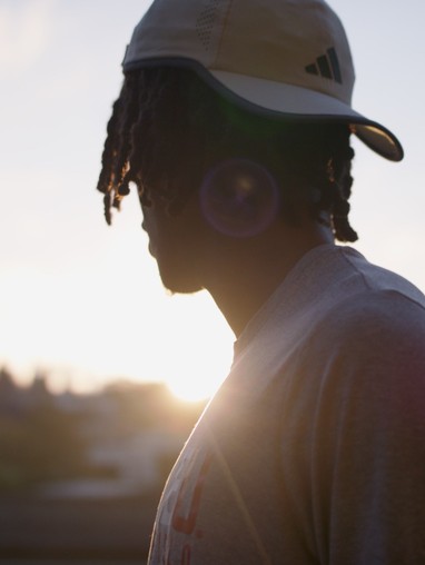 student athlete looking towards the horizon