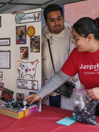 student at a booth
