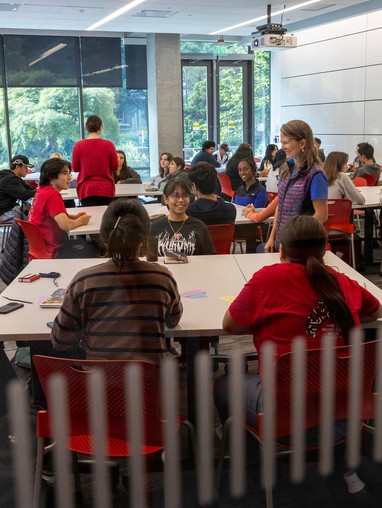A group of people sitting at tables.