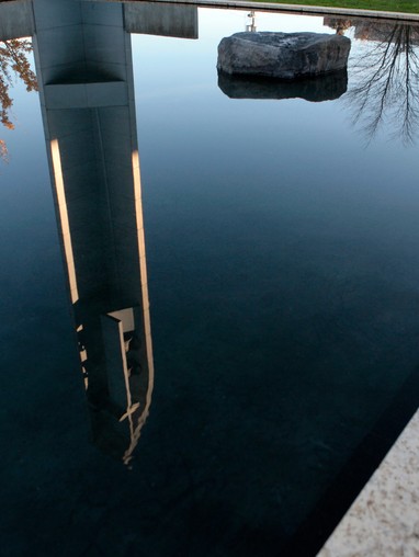 A reflection of the bell tower in the Reflection Pool next to the Chapel of St. Ignatius