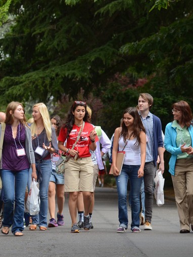 A group of people walking on a street.