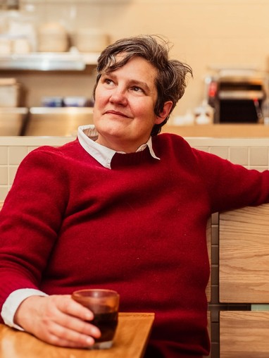 Jody Hall, founder of Wunderground Coffee, at a table at her cafe