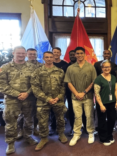 Veterans smiling in a group