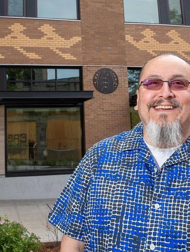 Student posing infront of a building
