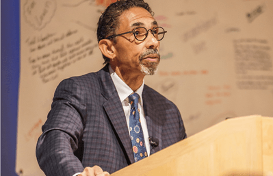 Robin D.G. Kelley speaking on a stage.