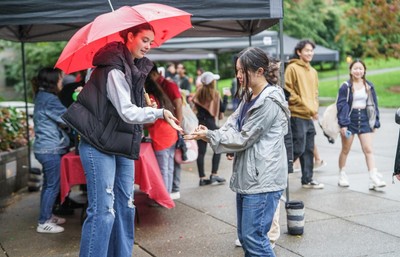 Student holding umbrella