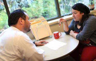 A man and woman sitting at a table.