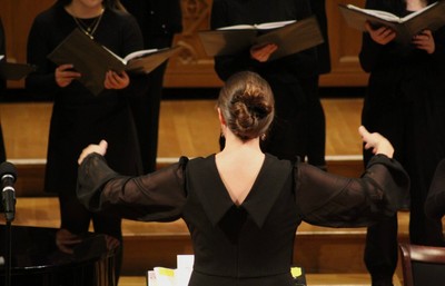 Photo of Leann Conley-Holcom conducting