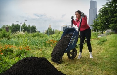 A SU alum helping with gardening at the Black Farmers Collective