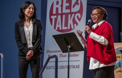 Sharon Suh and Natasha Martin speaking at an event