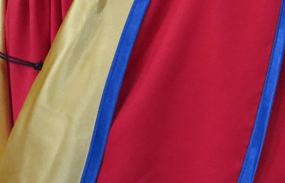 Close-up of bright red academic robes